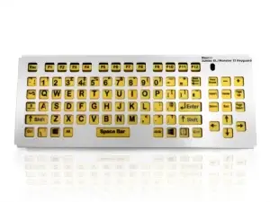 Picture of the metal keyguard on a yellow key keyboard