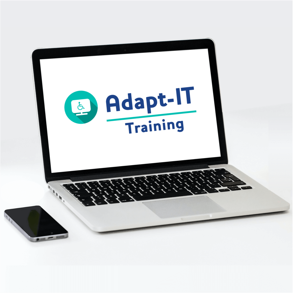A laptop with "Adapt-IT Training" written on it. To the left of the laptop is a phone.